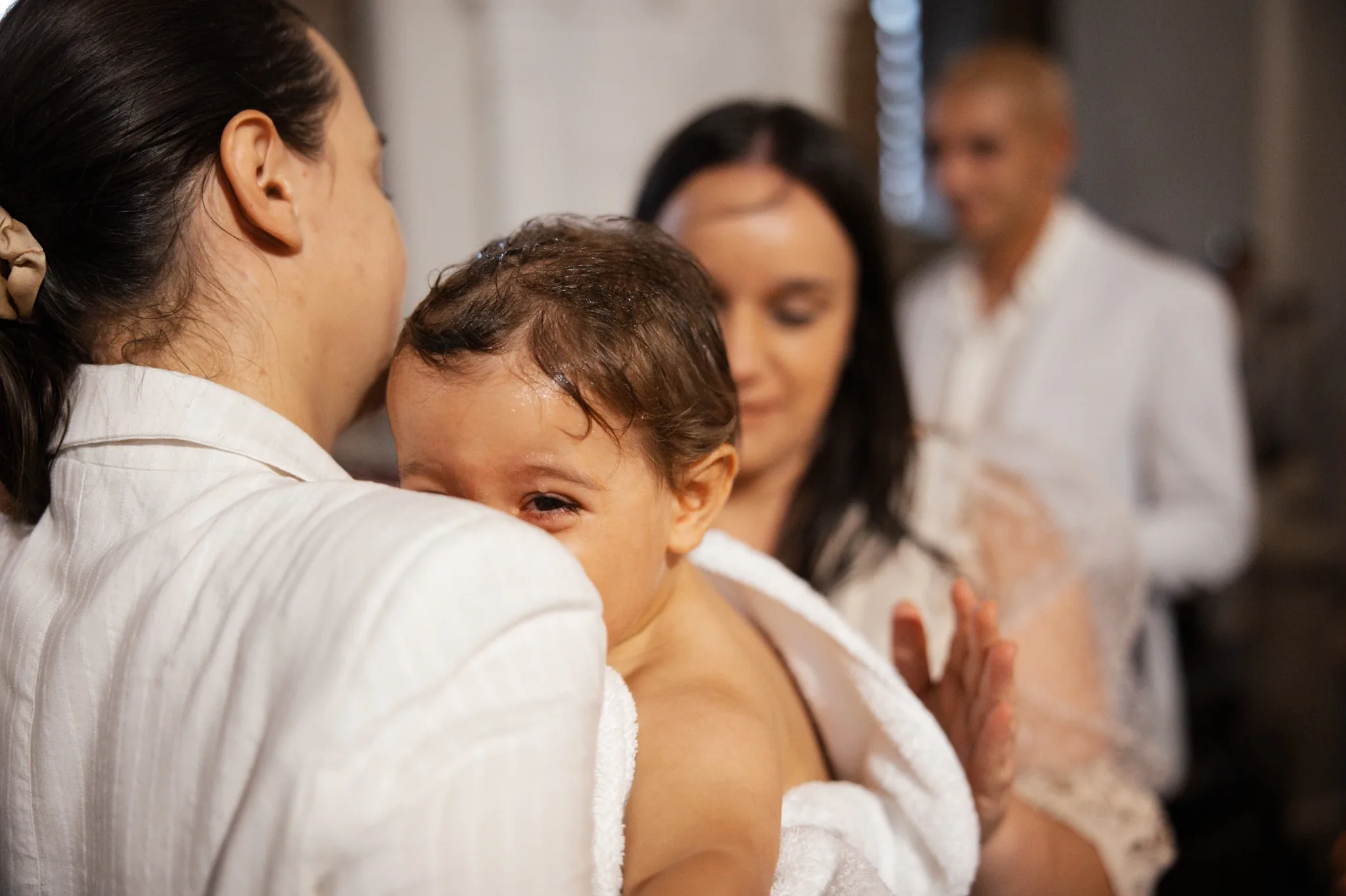 Бебе след ритуала – кръщене